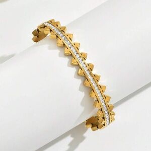 Gold plated stainless steel triangle and stone bangle bracelet